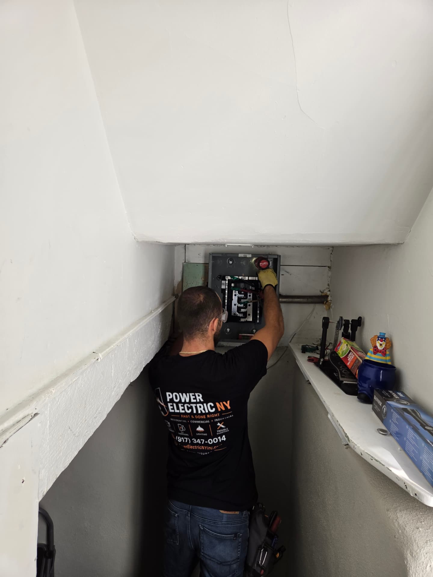 NYC electrician installing an electrical panel